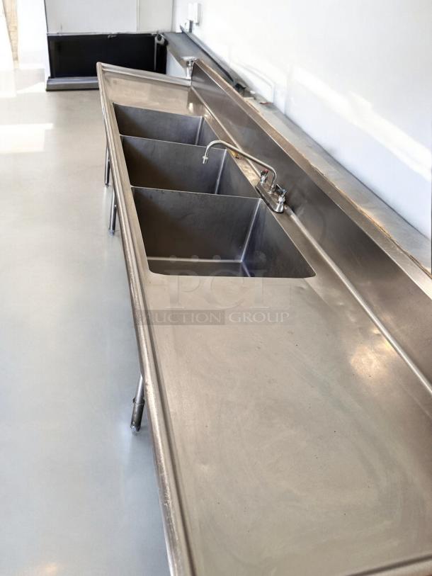 3-compartment stainless steel sink with dual drainboards, in excellent condition, fully tested and operational.