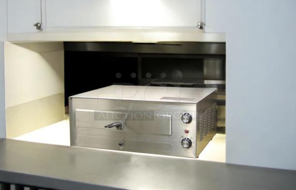 Commercial countertop electric pizza/bakery oven, stainless steel, excellent condition, fully tested, dual knobs, unbranded.