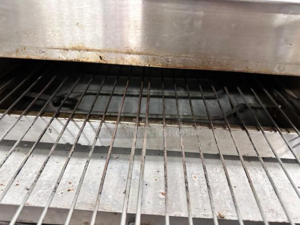 Wisco 560B countertop pizza oven, stainless steel, excellent condition, fully operational, interior rack view.