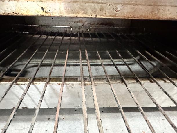 Wisco 560B countertop pizza oven interior view, excellent condition, tested and operational, showing wire rack and heating element.