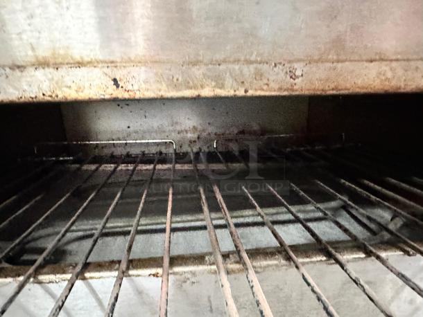 Wisco 560B countertop pizza oven interior with grill. Excellent condition, fully operational, tested for reliability.