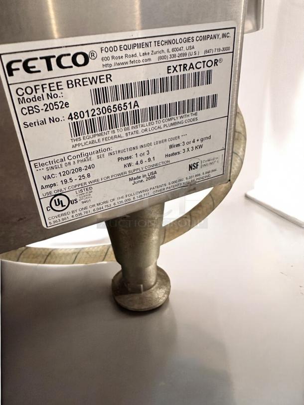 Fetco CBS-2052e Dual Coffee Brewer, excellent condition, with label showing model, serial number 480123065651A, and specs.