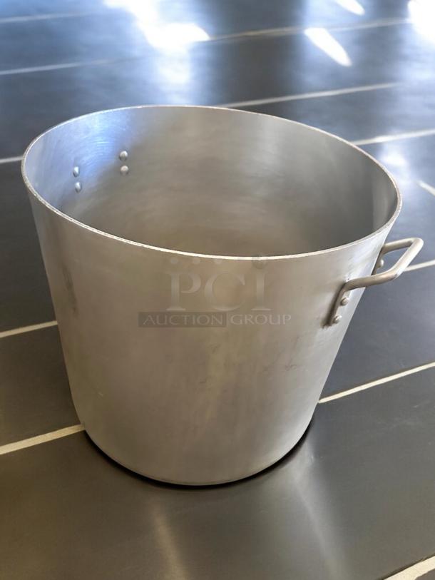 Heavy-duty aluminum stock pot, 80 Qt, excellent condition, commercial use, two sturdy handles, ideal for large batches.