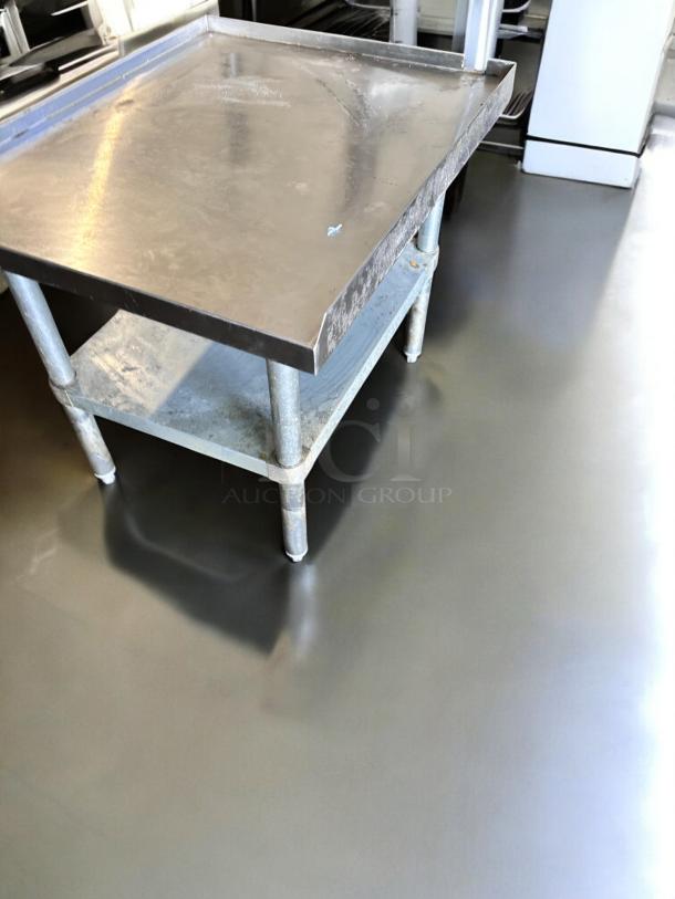GSW stainless steel work table, model ES-S3024, 30"x24" with undershelf, excellent condition, sturdy and smooth surface.