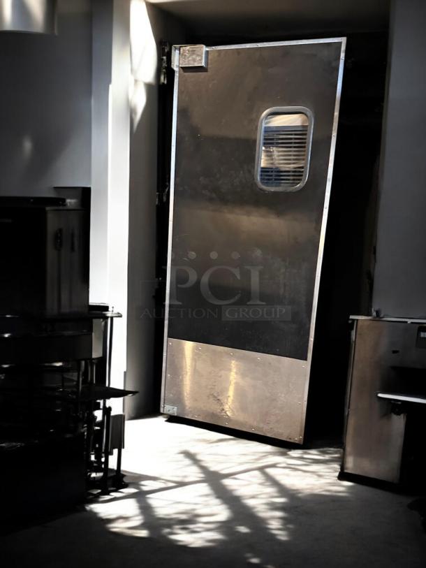 Eliason single swing traffic door, 36"W x 80"H, heavy-duty black finish, excellent condition, fully tested and operational.