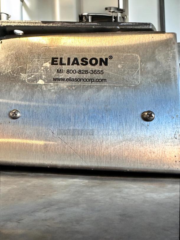 Eliason Swing Traffic Door, 36"W x 80"H, heavy-duty black finish, excellent condition, fully operational, visible Eliason label.