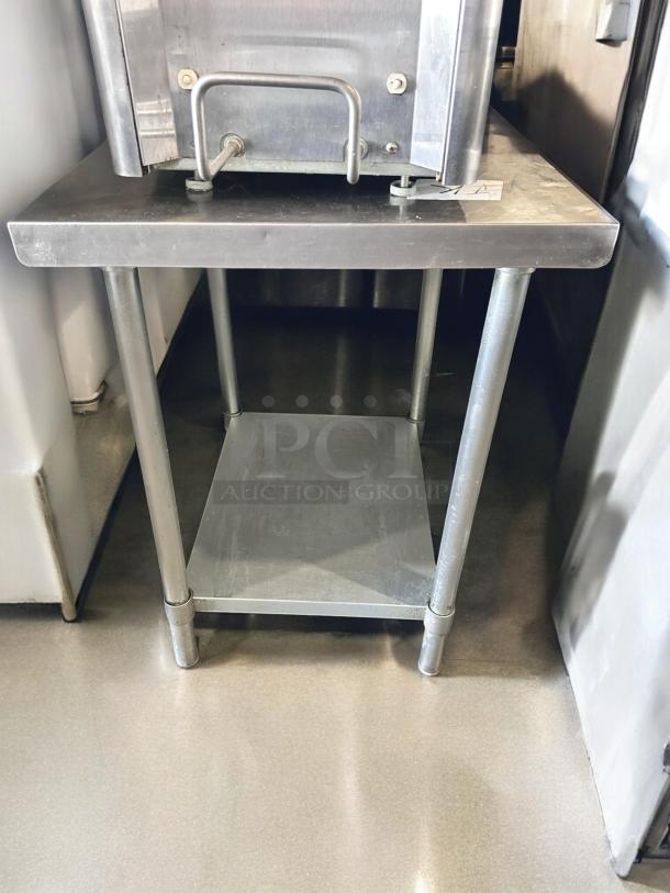 Commercial Stainless Steel Work Table, 24"W x 30"D x 34"H, excellent condition, with undershelf, tested and working.