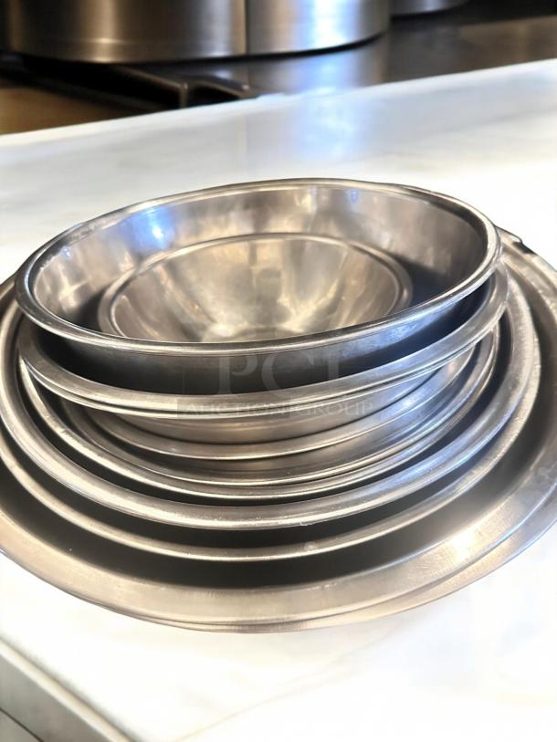 Lot of stainless steel mixing bowls, Commercial Foodservice brand, assorted sizes, in great condition, durable and ready for use.