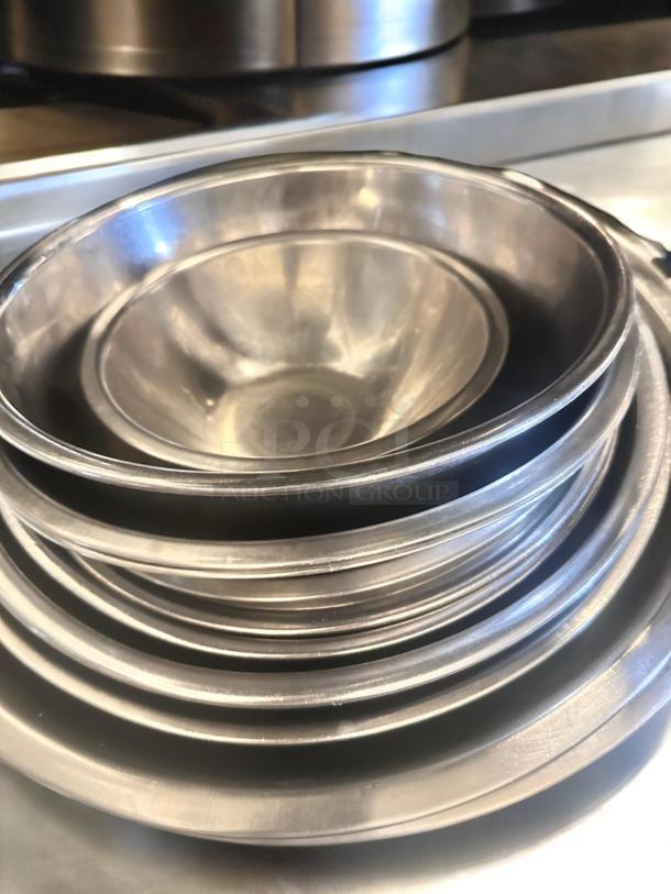 Lot of stainless steel mixing bowls, assorted sizes by Commercial Foodservice. Great condition, durable and ready for use.