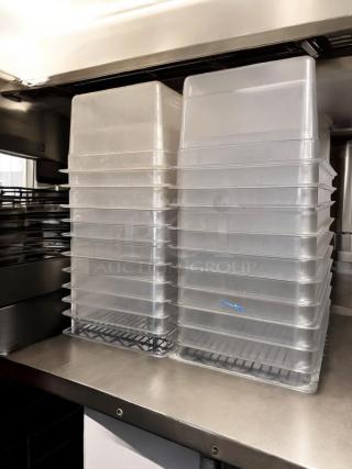 Stack of 22 polycarbonate food storage pans with lids in excellent condition, fully tested, and stackable.