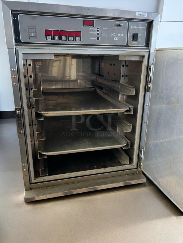 Henny Penny HC-903 CDT heated holding cabinet, stainless steel, open door, racks visible, excellent condition, fully tested.