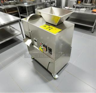 Commercial Automatic Meatball Maker in excellent condition, stainless steel, fully tested, visible control panel and warning labels.