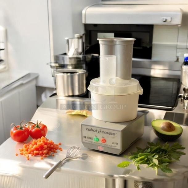 Robot Coupe R101 commercial food processor, excellent condition, fully tested and operational, shown on stainless steel surface.