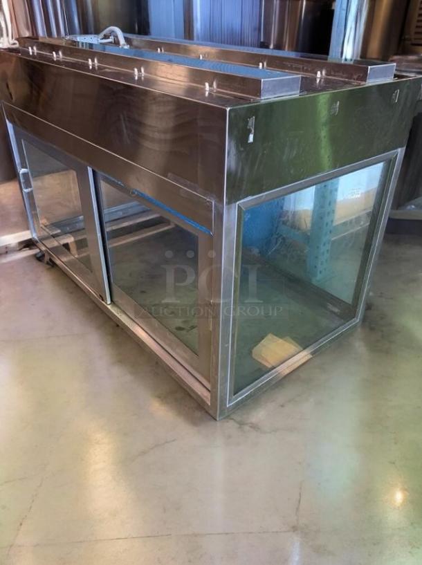 Stainless steel heated display cabinet in excellent condition, fully tested and operational, unbranded commercial model.