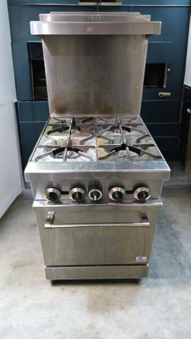 Commercial 4-burner gas range with oven in excellent condition, fully operational, stainless steel finish, tested.