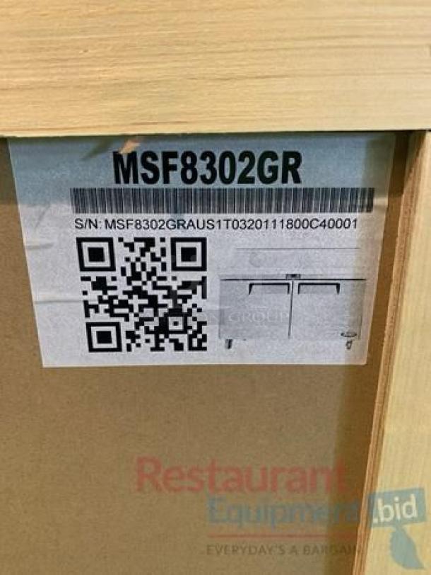 Label on Atosa MSF8302GR prep table showing model, serial number, and QR code; in excellent condition.