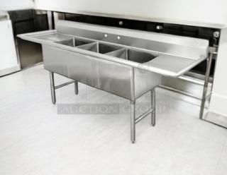 Stainless steel 3-compartment sink with dual drainboards, model FC-3-1515-15RL, excellent condition, fully operational.