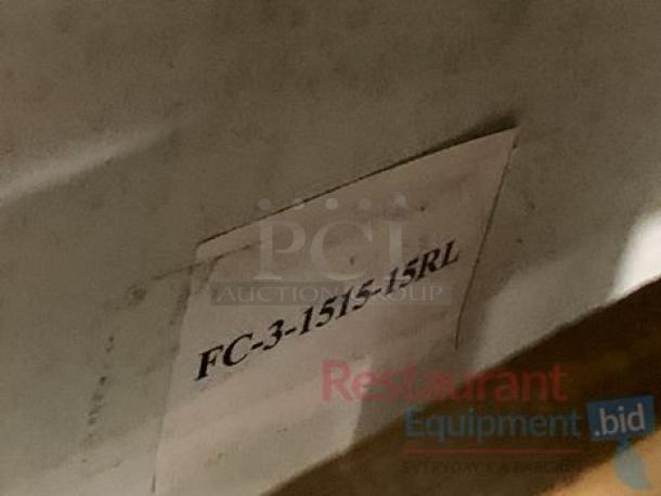 Label indicating model number "FC-3-1515-15RL" on stainless steel 3-compartment sink with dual drainboards.