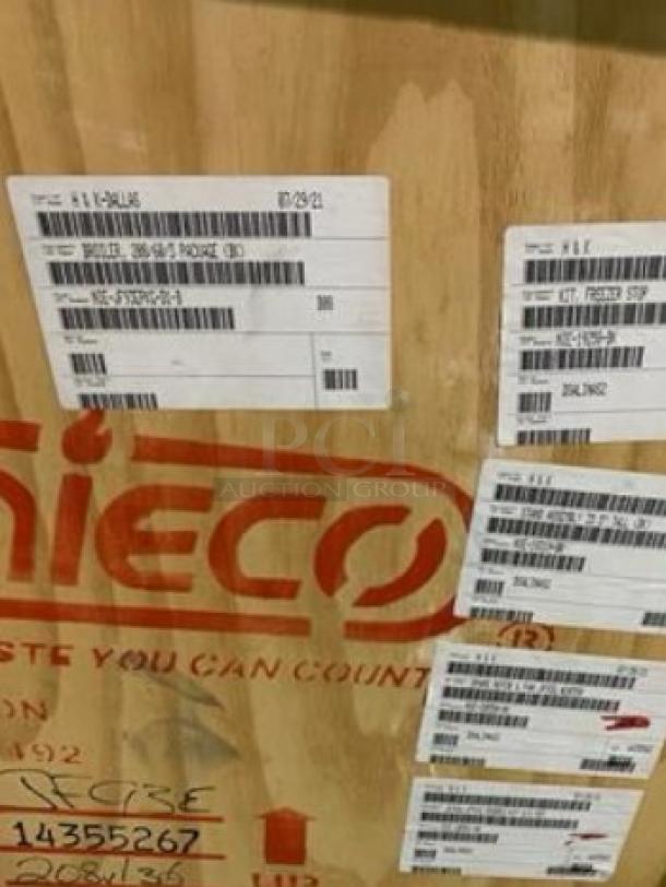 Brand new factory-sealed Nieco JF-62 automatic gas conveyor broiler, visible labels indicate model and shipping info.