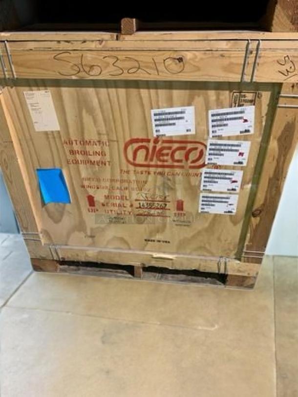 Brand new Nieco JF-62 Automatic Gas Conveyor Broiler in factory-sealed crate, ready for use. Labels indicate model and specifications.