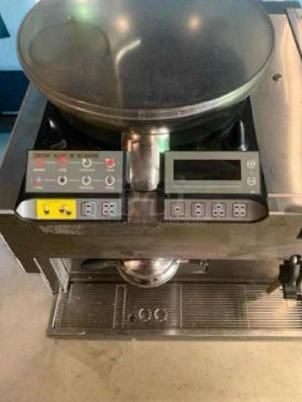 Commercial-grade automatic pita/flatbread maker in excellent condition, fully tested. Features control panel and metal housing.