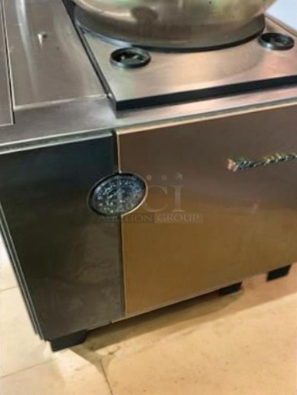 Commercial-grade automatic pita/flatbread maker in excellent condition, stainless steel, fully tested and working.