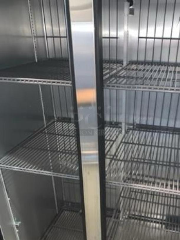 True T-35F-HC two-door reach-in freezer, excellent condition, steel shelves, fully tested, 115V, by True Manufacturing.
