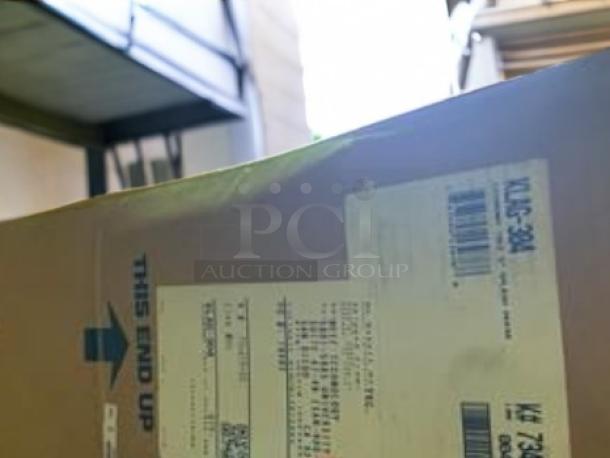 Factory sealed box with Advance Tabco LAG-304 stainless steel work table, 30" x 48", 5" backsplash, shipping label visible.