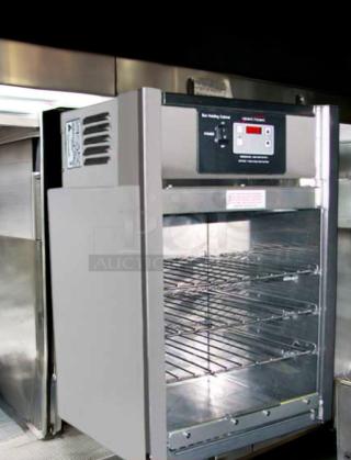 Henny Penny BW-100 Bun Warmer in excellent condition, stainless steel, 120V, with digital controls, open door showing shelves.