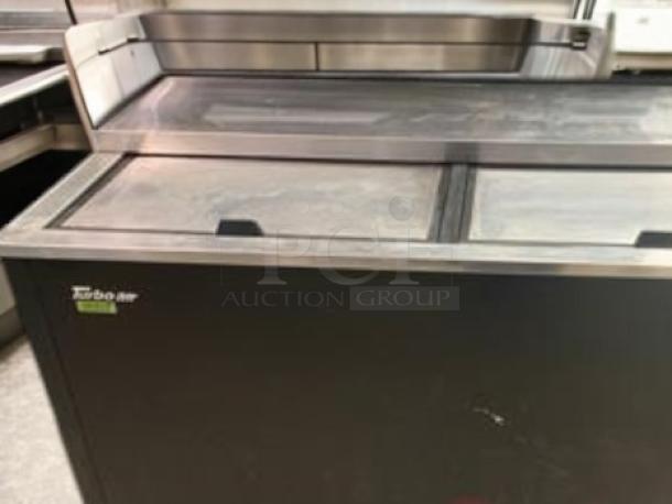 Turbo Air TBC-50SB-N6 bottle cooler, 50" wide, in excellent condition. Features sliding top doors, 115V, fully tested.