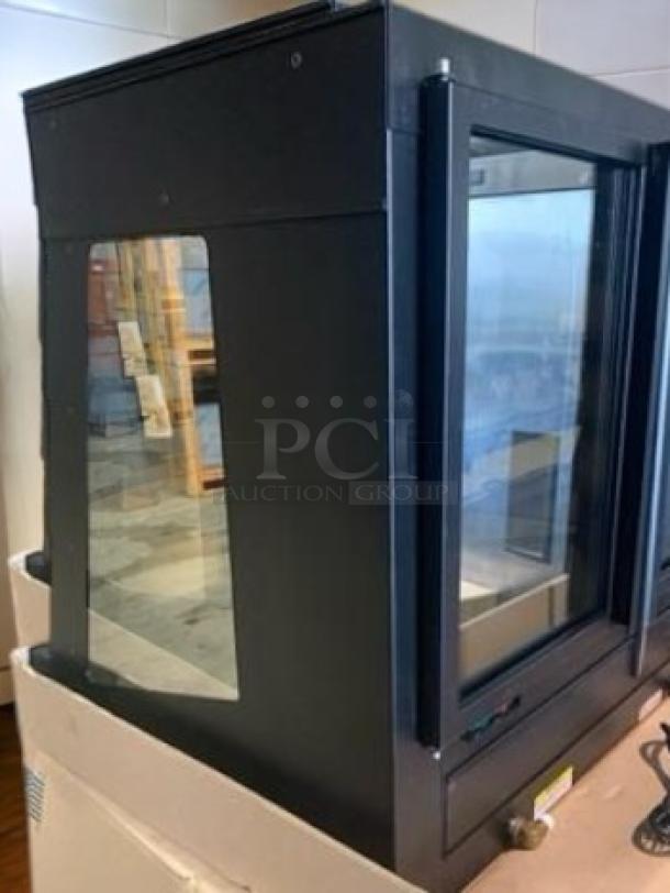 Nemco 4-tier glass hot food display warmer, excellent condition, fully tested. Black frame, transparent sides for visibility.