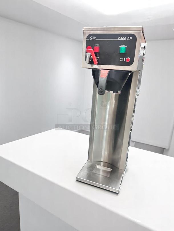 Curtis C500 AP Coffee Brewer, excellent condition, 120V, stainless steel, tested and working, red and green switch indicators.