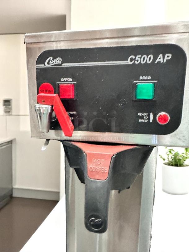 Curtis C500 AP coffee brewer, excellent condition, controls visible, 120V, tested and working, hot water and brew options.