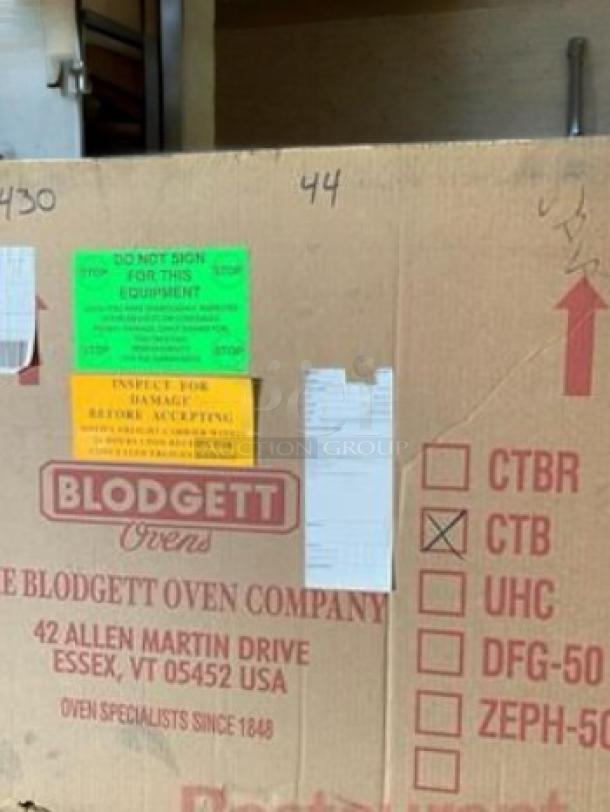Brand new Blodgett CTB countertop electric convection oven in original packaging. Labels indicate inspection and model.