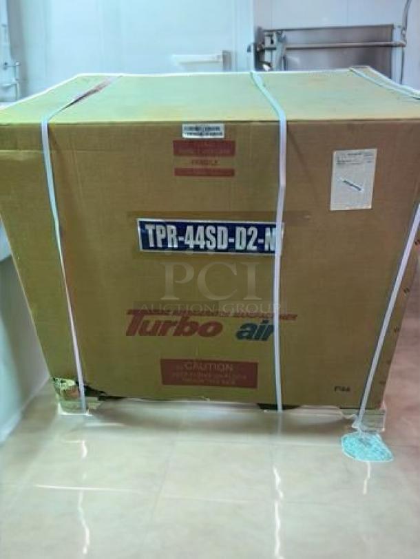 Brand new, factory-sealed True prep table, model TPR-44SD-D2-N, 115 V, in original packaging, ready for use.