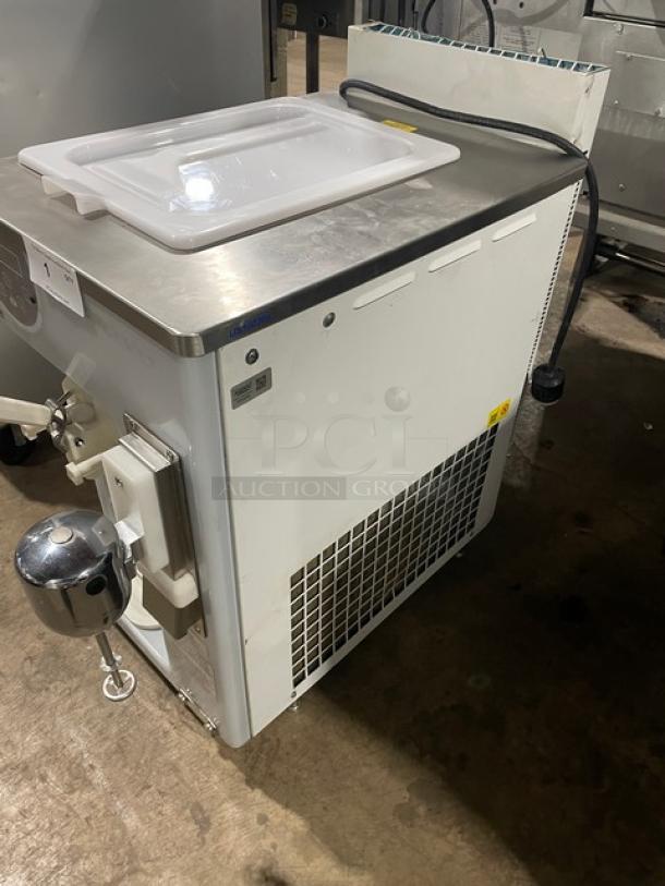 Carpigiani 191 SP/US/E P stainless steel single flavor soft serve machine with beverage mixer, 208-230V, 3 phase, on legs.