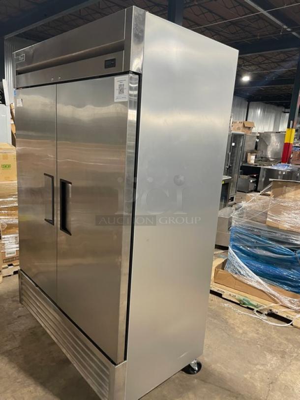 True T-49F-HC Commercial Stainless Steel 2 Door Reach-In Freezer with poly-coated wire racks, on casters.