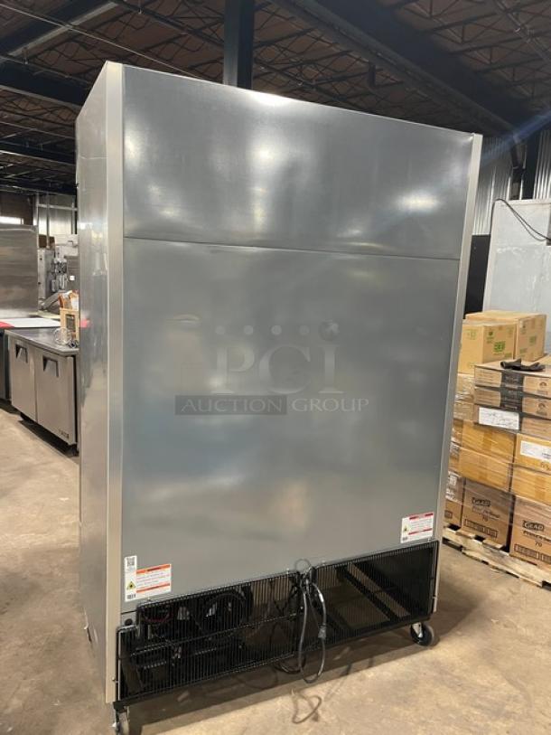 True T49FHC commercial stainless steel 2-door reach-in freezer with poly-coated racks, 115V, on casters, in good condition.