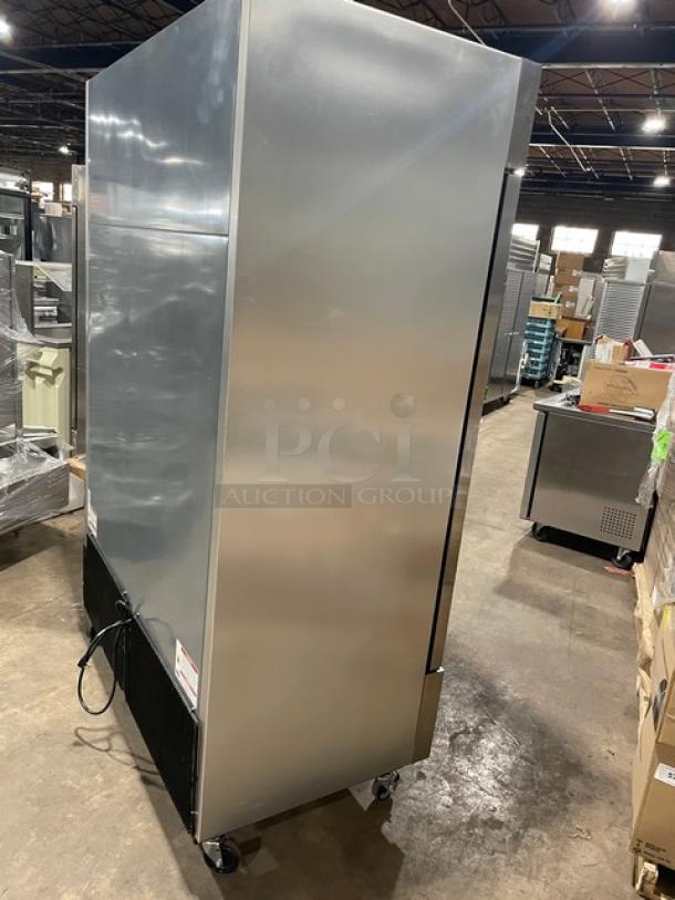 True T-49F-HC commercial stainless steel reach-in freezer with two solid doors, poly coated racks, and casters.