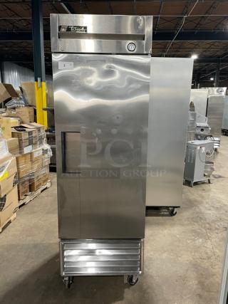 True T-23 commercial stainless steel single door reach-in refrigerator on casters, with poly-coated wired rack, model T-23, SN 1-3932455, 115V 1 Phase, excellent condition.