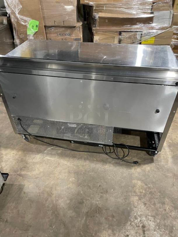 True TWT-60 stainless steel 2-door worktop refrigerator, Energy Star certified, with backsplash, poly-coated rack, on casters.
