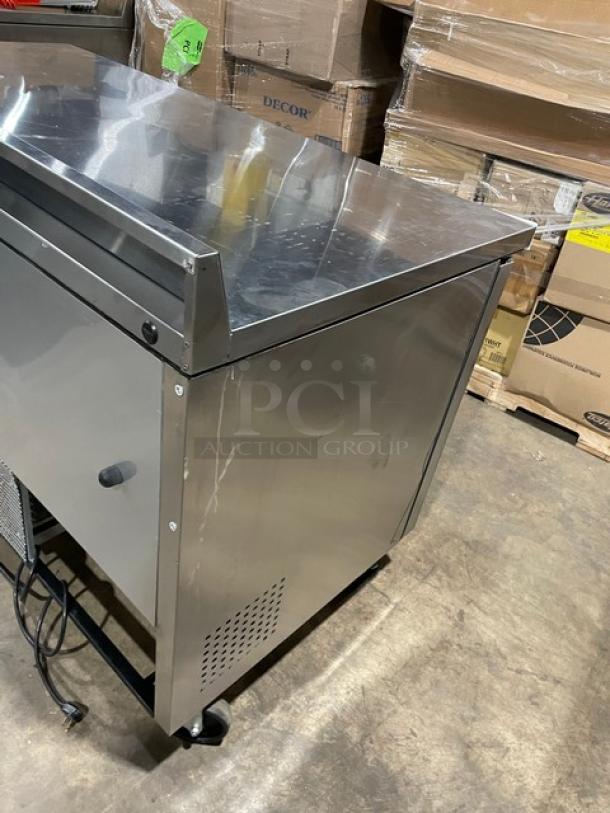 True TWT-60 stainless steel 2-door worktop refrigerator, Energy Star certified, with back splash, poly coated rack, on casters.