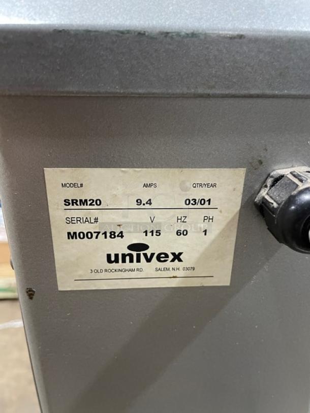 Univex SRM20 commercial mixer with label showing model SRM20, serial M007184, 115V, on legs.