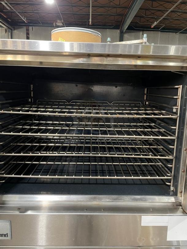 Southbend SilverStar Series stainless steel double convection oven with thermostatic controls and wired rack, open door view.