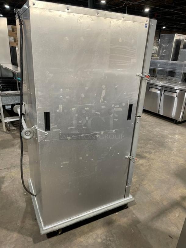 Cres-Cor stainless steel insulated heated cabinet with Dutch doors, wide pan slides, rubber bumper guard, on casters.