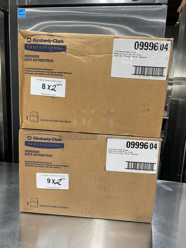 Kimberly Clark Sanitouch dispenser boxes, model 09996, new condition, two boxes on steel surface, labels visible.