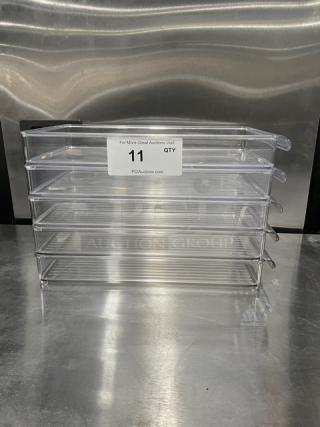 New lot of 11 clear polycarbonate rectangular food pans, commercial grade, stacked, labeled for auction, pristine condition.