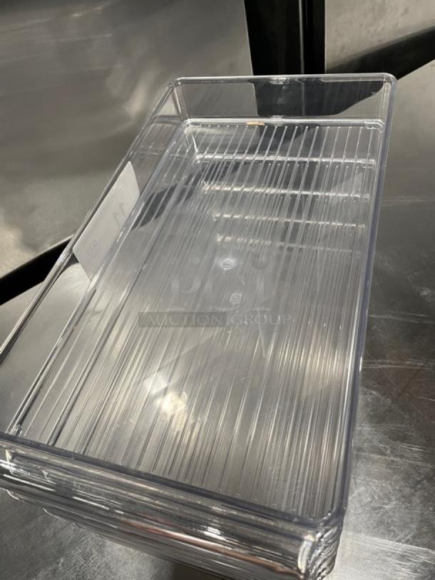 New clear polycarbonate rectangular food pan, commercial grade, pristine condition, stackable design, ideal for kitchen use.
