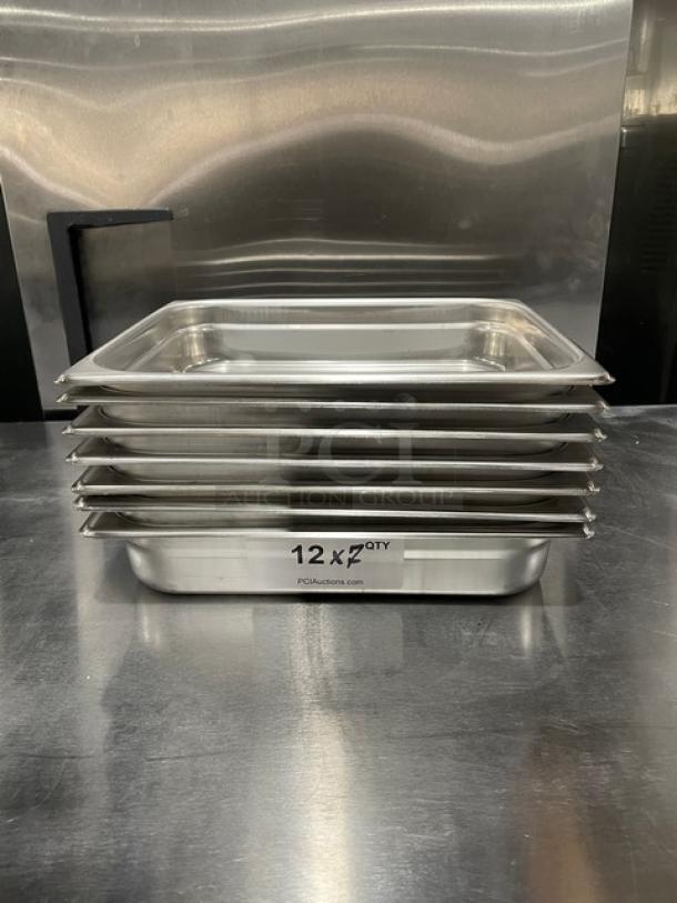 Winco SPJH202 stainless steel hotel pans, new condition, stack of seven. Labels indicate model and auction multiplier.
