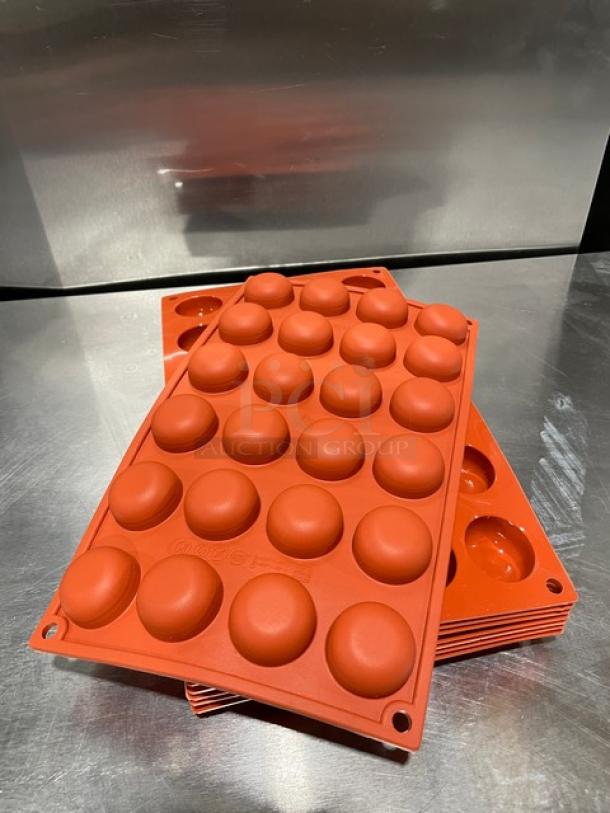 Silikomart 24-cup round non-stick silicone mould. New condition, stack of moulds shown, ideal for commercial baking.